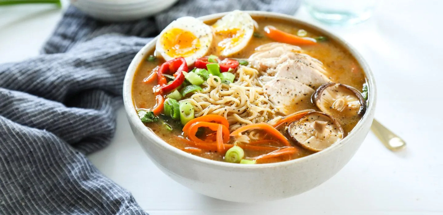 A rich, creamy tonkotsu ramen bowl with chashu pork, soft-boiled egg and kikurage mushrooms